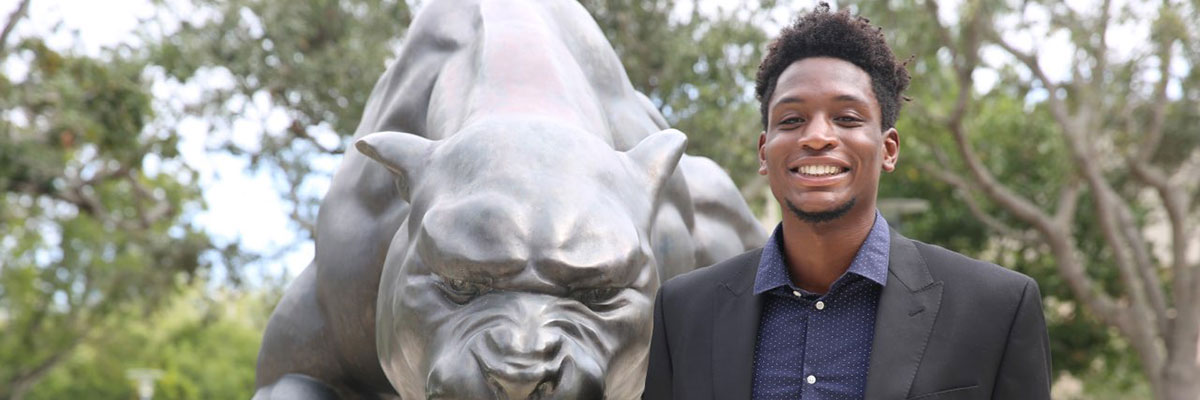 Price in front of the FIU fountain