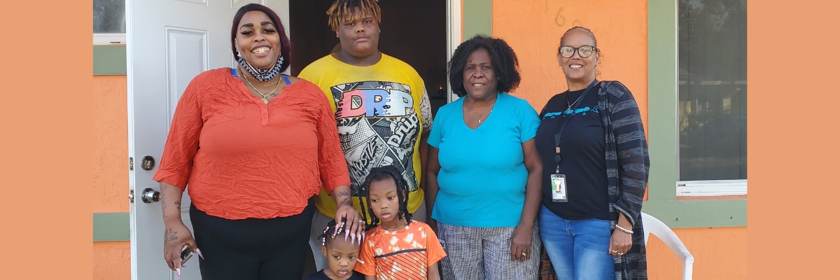 A family in front of a house