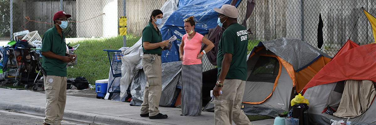 Homeless person with outreach staff