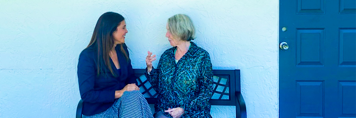 Two women sitting on a bench